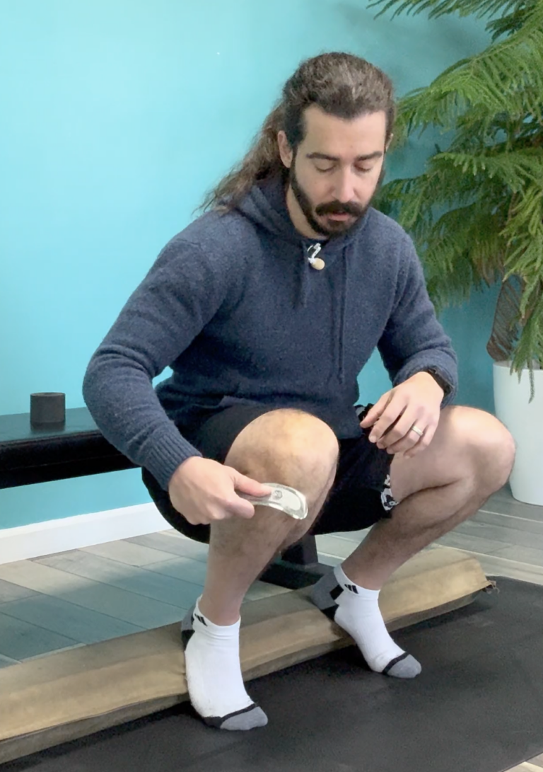 Dr. John muscle scraping around his knee for knee mobility